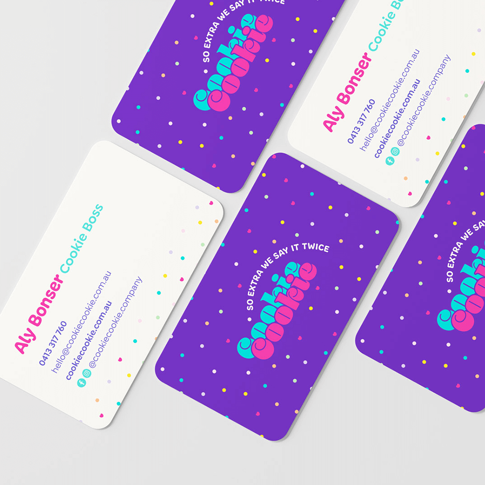 Front and back of Cookie Cookie business cards laying on a flat surface.